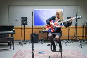 Singer-songwriter in classroom example