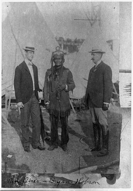 Geronimo and two other men standing for a photo, full length at the Pan-American Exposition, Buffalo, N.Y.