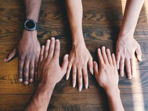 hands on a wooden table