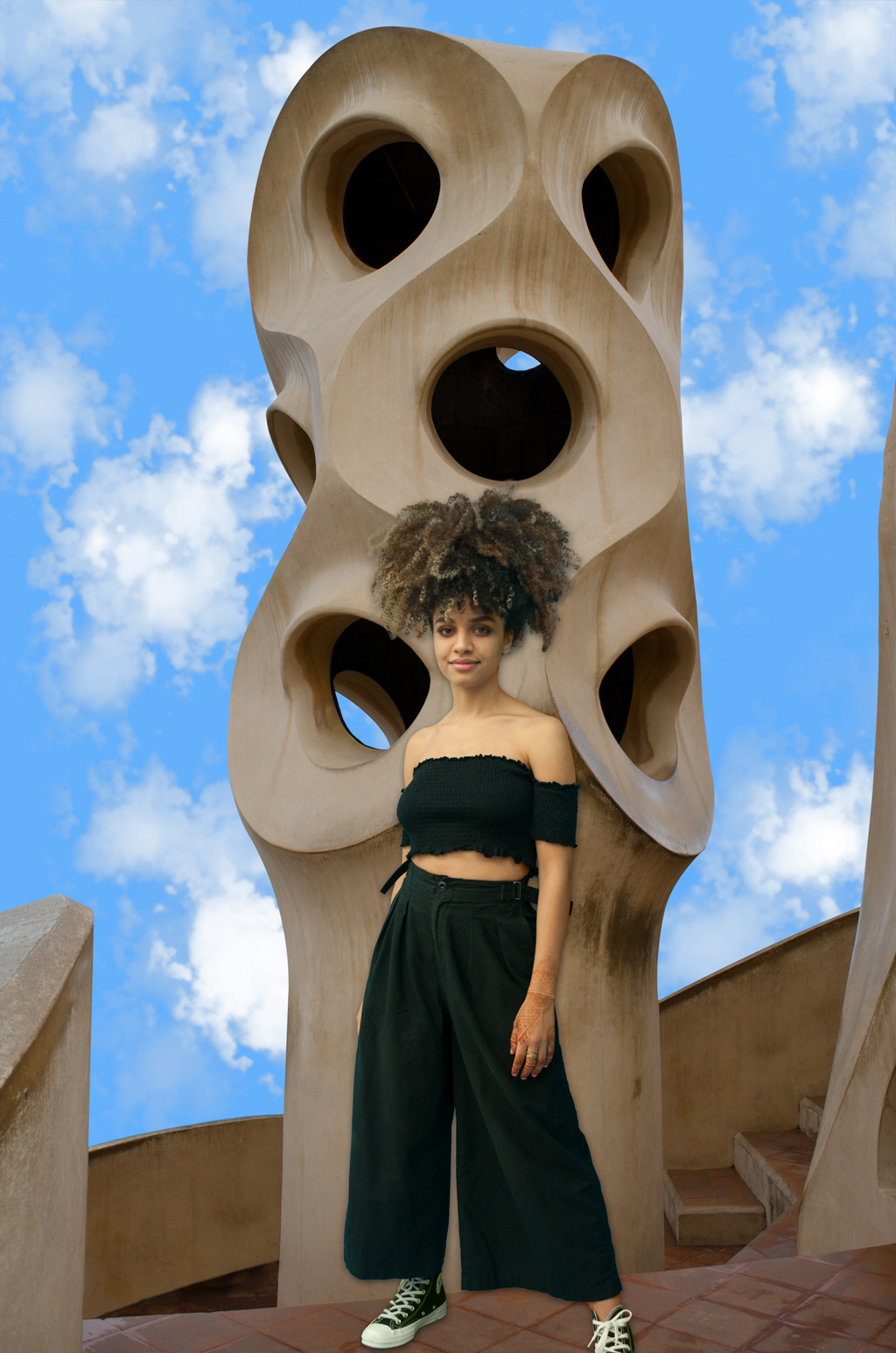 A cropped photo of a woman with curly hair was placed over a different background. However, the cropped image edges is apparently not well blended with the background.