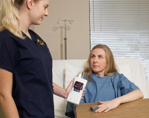 The healthcare provider is correctly measuring oxygen saturation with nail polish removed