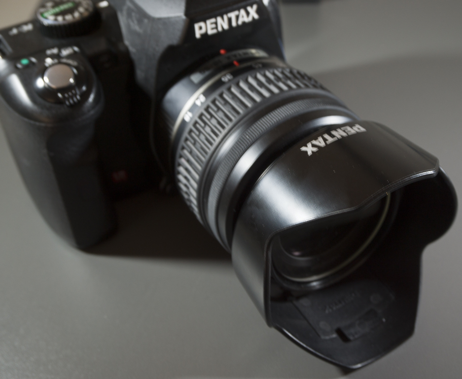 A lens hood reduces reflected glare onto the lens, which increases the contrast of photos and avoids artifacts from stray light.