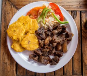 This is a photo of the dish called Griot, the national dish of Haiti. Click the image to learn how to prepare this recipe at savorythoughts.com