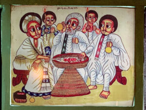 A painting of an Ethiopian family enjoying injera and wat together. Click the image to see how injera is made on youtube.com