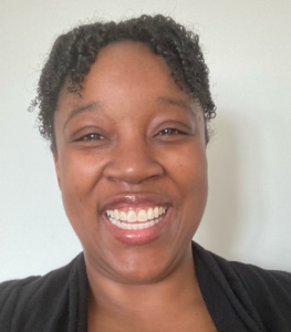 This is an image of Karrianne, a Registered Psychotherapist in Ontario with over 14 years of experience. Her warmth reflects her compassionate approach to supporting mental health in all ages in marginalized communities.