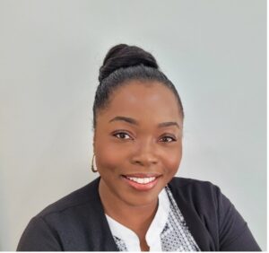 This is an image of Tameika Shaw, a Registered Dietitian and Manager of Primary Healthcare Services at TAIBU Community Health Centre, reflecting her leadership in community health