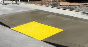 An accessibility ramp on a sidewalk