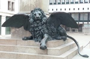 Sculpture of lion with wings.